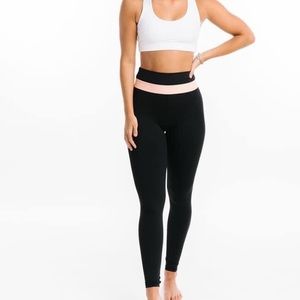 Zyia athletic legging. Peach logo band at waistline. NWOT never worn! 8/10